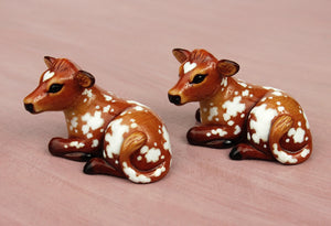 brown cow figurines